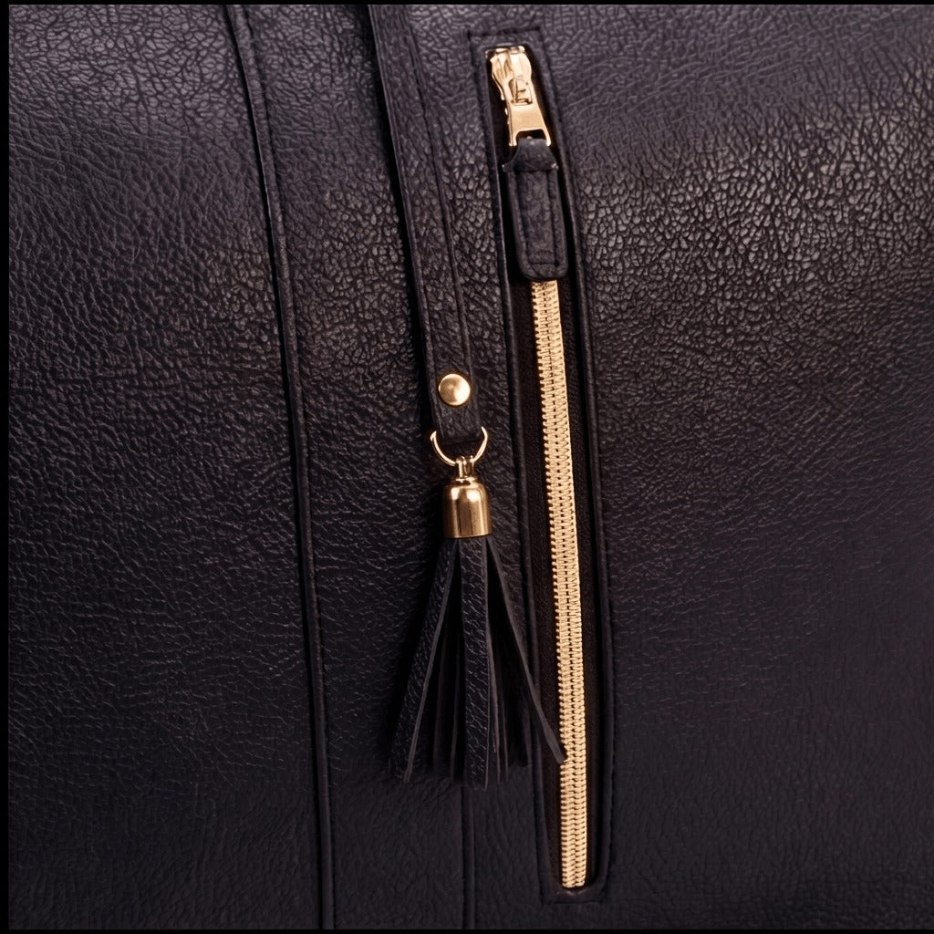 Charcoal bag zipper and tassel close-up